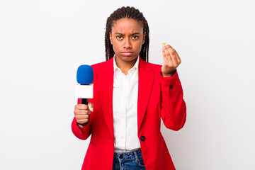 young adult black woman making capice or money gesture, telling you to pay. presenter and...