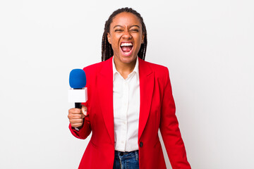 young adult black woman shouting aggressively, looking very angry. presenter and microphone concept