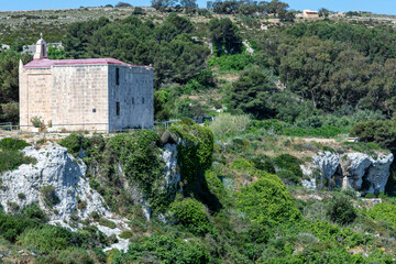 Fototapeta na wymiar Small church on a cliff on the Island of Malta