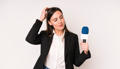 young adult pretty woman smiling happily and daydreaming or doubting. presenter with a microphone...