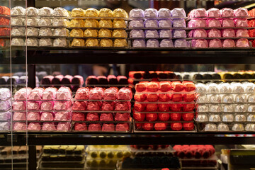 Chocolate stand. Patisserie chocolate counter. Specially coated chocolates. close up