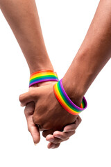 Closeup of two Asian man holding hands with a rainbow-patterned wristband on their wrists on white