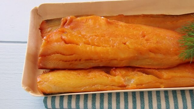 smoked haddock fillet in a tray with dill
