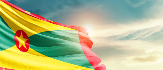 Grenada national flag cloth fabric waving on the sky - Image - obrazy, fototapety, plakaty