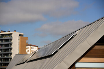 State-of-the-art solar panels placed on the roofs of houses of ecological construction