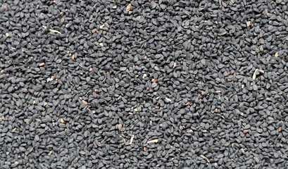 Nigella seeds texture close up photo. Natural pattern. Abstract natural background. 