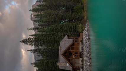 Vertical 4k Emerald Lake Lodge, Time Lapse. Heavenly Nature of Yoho National Park BC, Canada Clouds Moving Above Conifer Forest and Aqua Blue Water - Powered by Adobe