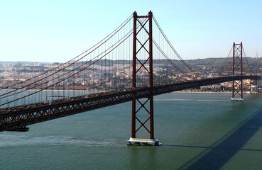 Suspension bridge Ponte 25 de Abril across the river Tahoe in the capital of Portugal - Lisbon