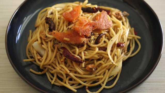 stir-fried spaghetti with salmon and dried chilli - fusion food style