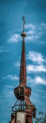 the sharp spire of the Orthodox bell tower