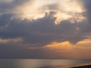 Cloudy multicolored sky over the sea surface of the water. seascape at the resort