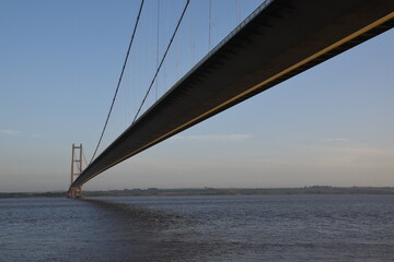 the Humber bridge crossing the river Humber during sunset