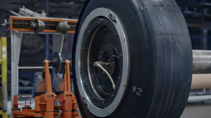 Fototapeta na wymiar Factory tyre blank production process in modern warehouse rubber tape rotating