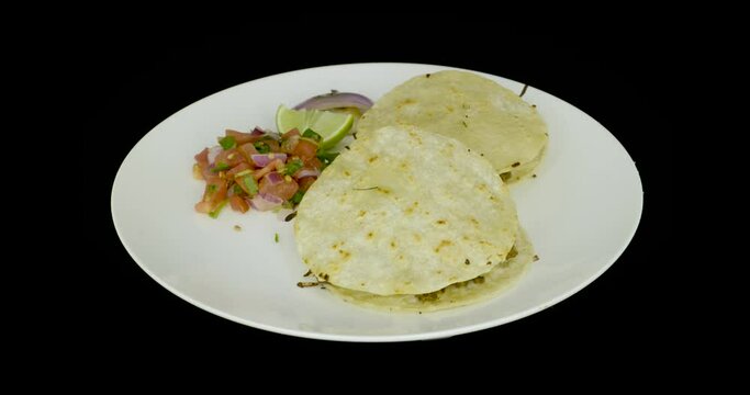 Two gringas with pico de gallo on a turntable. Mexican food