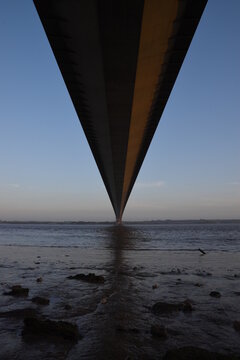 the Humber bridge crossing the river Humber during sunset