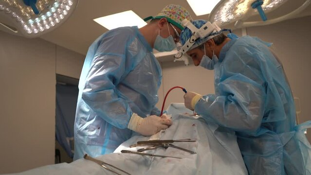 Doctors are doing surgery in modern operating room