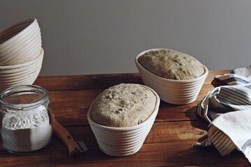 Sourdough bread proofing and cutting. Chef baking bread