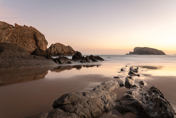 The spectacular rock formations on the shore of La Arnía beach at low tide at sunrise, Costa Quebrada, Liencres, Cantabria, Spain