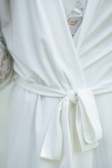 The bride's white robe, close-up.