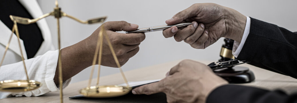 Attorneys or consultants who work in the courtroom are currently investigating the company's corruption cases and have their clients sign legal confirmation, Litigation and justice concept.