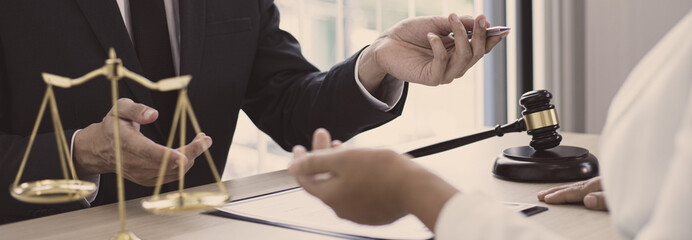 Attorneys or consultants work in the courtroom and negotiate with clients or complainants who want justice in corporate fraud cases, Litigation and justice concept.