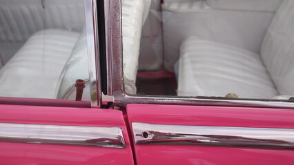Window frames of a pink retro car close-up, Cuba, Havana