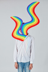 a piece of the rainbow comes out of the young man's chest, concept of LGBTQ pride, LGBTQ rights...