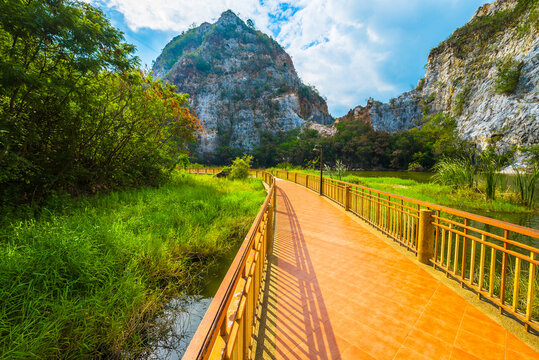 Mountain Snake Stone Park, or Khao Ngu Stone Park, limestone mountain hill and lake with a suspension bridge, tourist attraction in Ratchaburi province, Thailand
