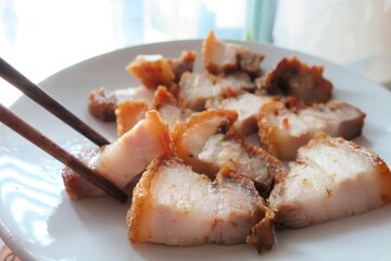 Crispy pork on white plate. Food concept.