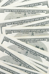American paper dollar bills background. Hundred dollar banknotes texture, currency concept