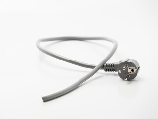 A piece of the cut cable with electric plug on the white background