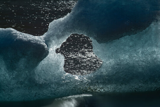 Icebergs dot the shore of Laguna Torre, abstracted by a long exp