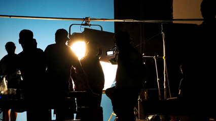 Behind the scenes of video production shooting studio in silhouette which have professional...
