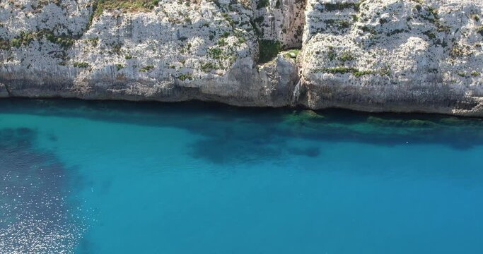 Aerial view of cliffs, stones and sea. spring time. Europe. The camera moves forward. Island of Malta