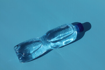 bottle of cold water on blue background