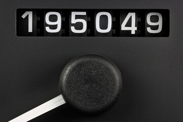 odometer of used car showing mileage of 195049 km - obrazy, fototapety, plakaty