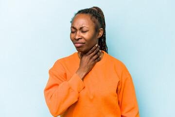 Fototapeta na wymiar Young african american woman isolated on blue background suffers pain in throat due a virus or infection.