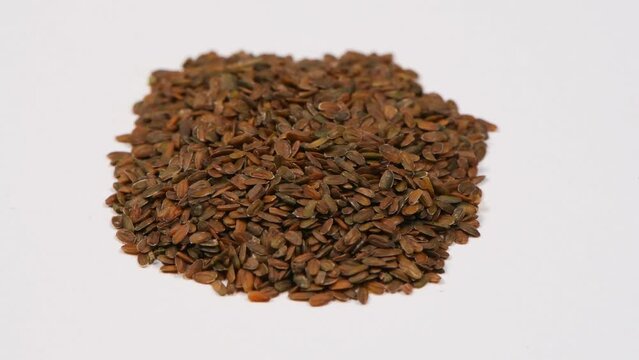 A heap of quality seeds of mathiola. Clockwise rotation. Side view. Loop motion. Rotation 360. 4K UHD video footage 3840X2160.