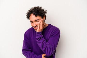 Young caucasian man isolated on white background laughs happily and has fun keeping hands on stomach.