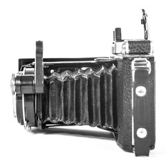 film camera on a white background with an accordion lens isolate