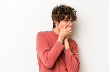 Young caucasian man isolated on white background scared and afraid.