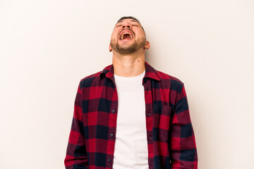 Young hispanic man isolated on white background relaxed and happy laughing, neck stretched showing teeth.