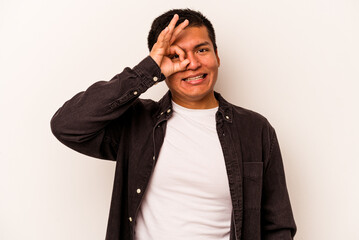 Young hispanic man isolated on white background excited keeping ok gesture on eye.