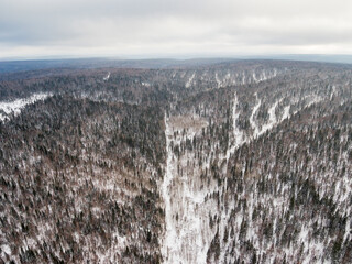 Southern Urals, Ural Mountains. Mountain taiga in winter. Aerial view.