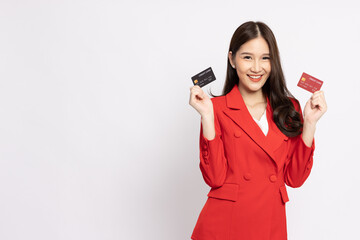 Naklejka premium Happy young Asia businesswoman smiling and showing two credit card for paying online business isolated on white background