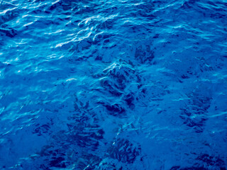 Calm water surface. Abstract nature background. Various shades of gray and blue.