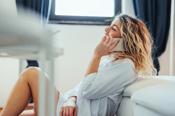Woman in pajamas talking on phone