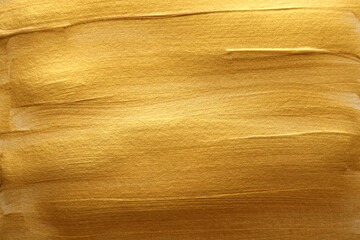 Gold (bronze) color smear brushstroke stain blot horizontal background. Abstract Painting texture.