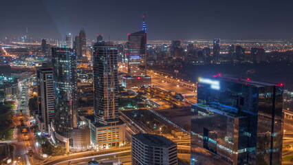 Fototapeta na wymiar Aerial view of media city and al barsha heights district area all night timelapse from Dubai marina.