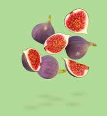  Set of perfectly retouched figs soars in space isolated on green background